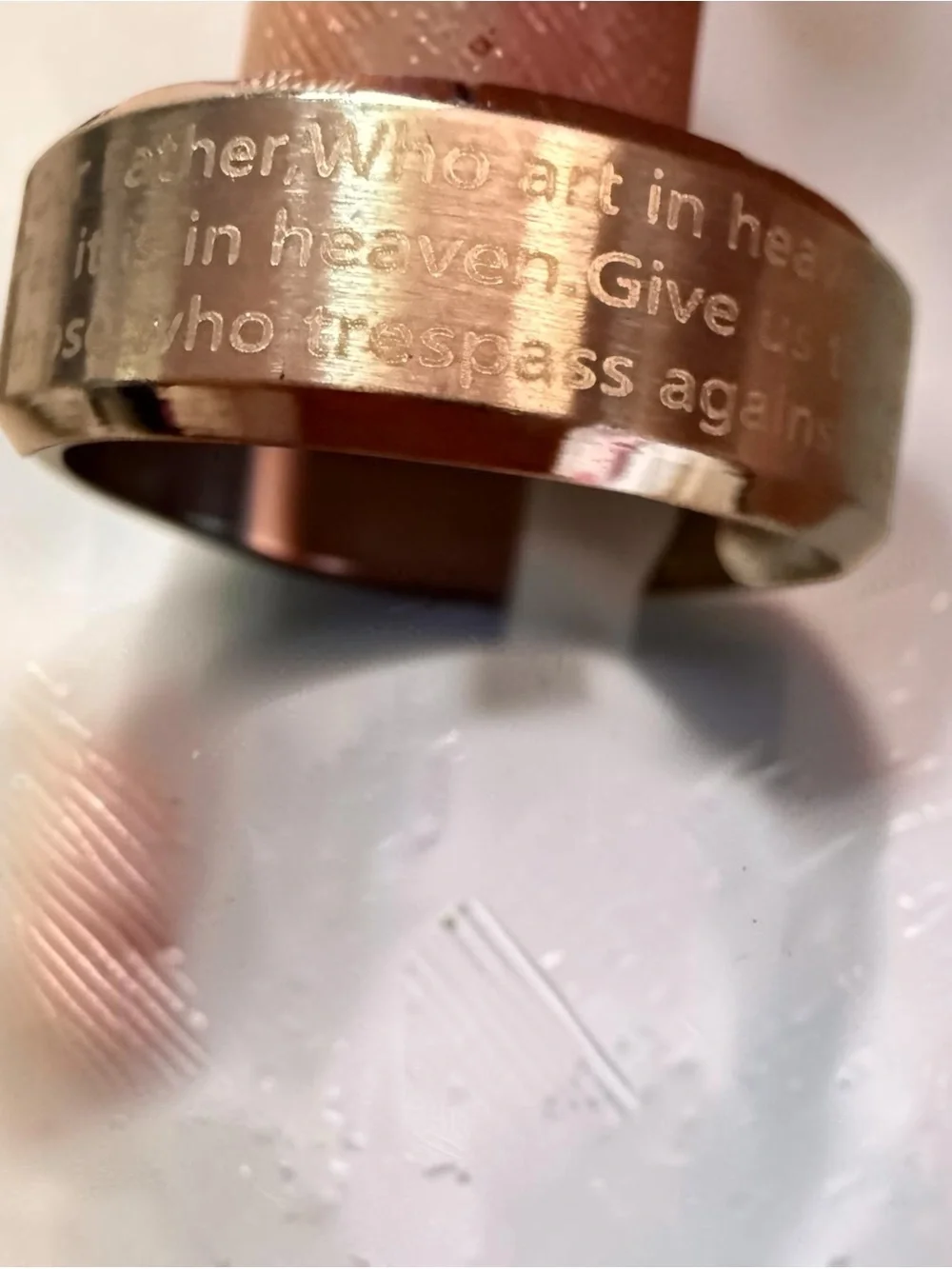 The Lord’s Prayer engraved locket and The Lord’s Prayer engraved ring. Stainless
